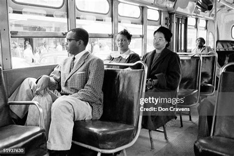 American Civil Rights activist Rosa Parks rides a bus at the end of ...