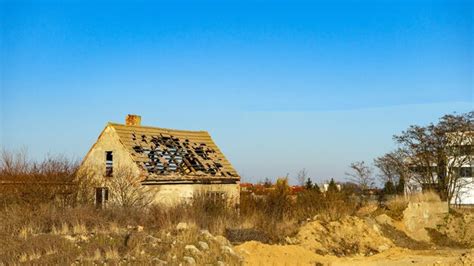 Premium Photo An Old Dilapidated Abandoned House On A Vacant Lot