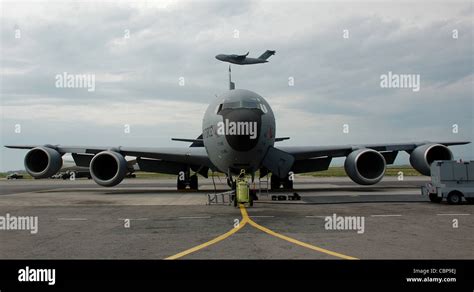 While A KC 135 Stratotanker Waits For The Next Mission A C 17