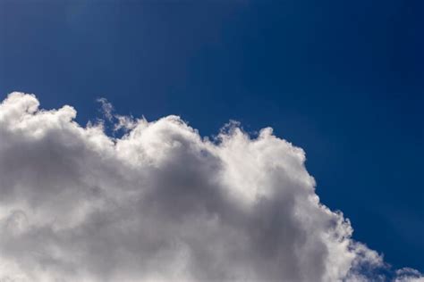 Premium Photo Clouds Floating Across The Sky In The Daytime