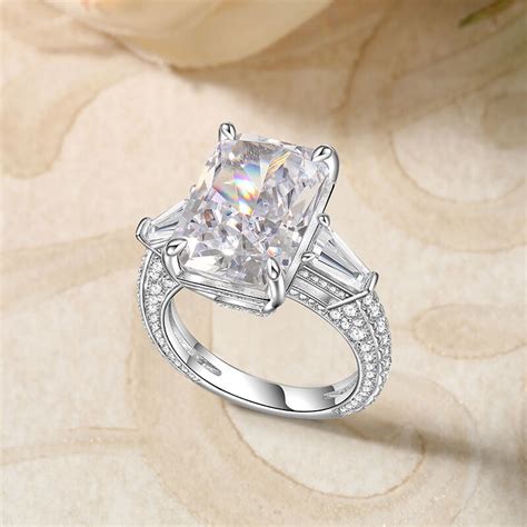 Jeulia Three Stone Emerald Cut Sterling Silver Engagement Ring Jeulia