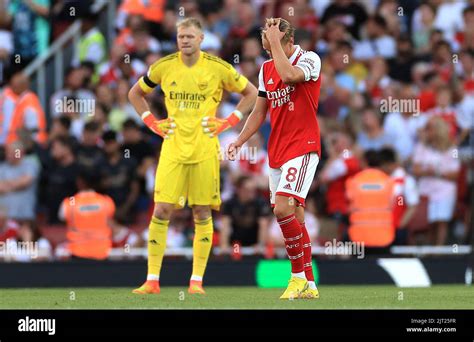 Arsenals Martin Odegaard Right And Goalkeeper Aaron Ramsdale Look Dejected During The Premier