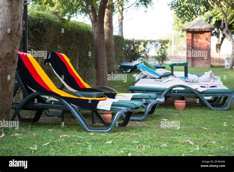 Towels In The Colours Of The German Flag Are Used To Reserve Sun