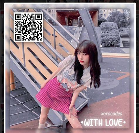 A Girl Sitting On Top Of A Bench Next To A Wooden Bench With Qr Code