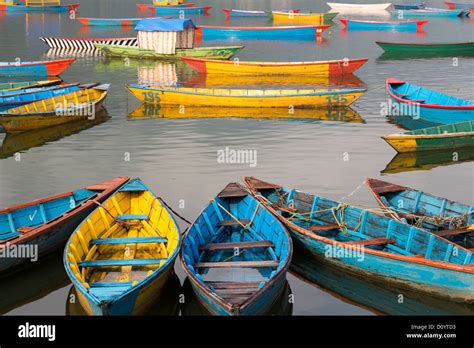 Many Colorful Wooden Boat Standing On Phewa Or Fewa Lake In Pokhara