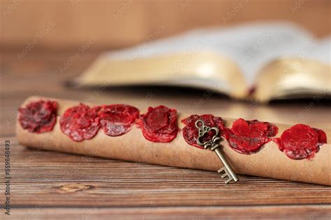 Ancient Scroll With Seven Seals With Old Key On Wooden Table With Holy
