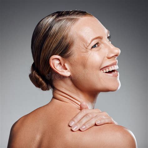 Beautiful Mature Woman Posing In Studio Against A Grey Background Stock Image Image Of Happy