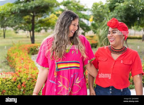 Stock Photo Of Latina Friends Walking Down The Street In The City
