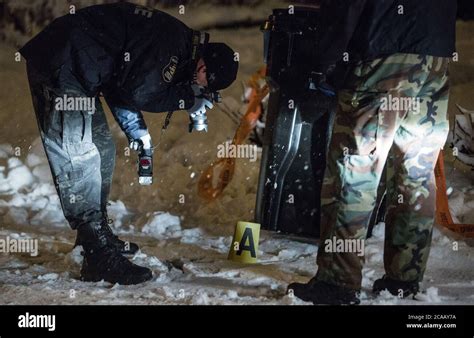 Crime Scene Investigation Police Officer Take Picture From A Crime