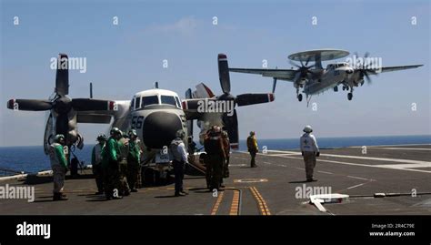 US Navy Sailors Watch As An E 2C Hawkeye Assigned To Carrier Airborne