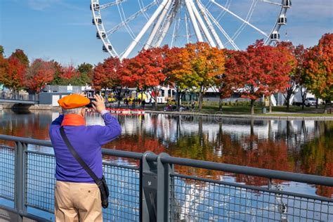 View of the Old Port of Montreal and Montreal Ferris Wheel in Autumn ...