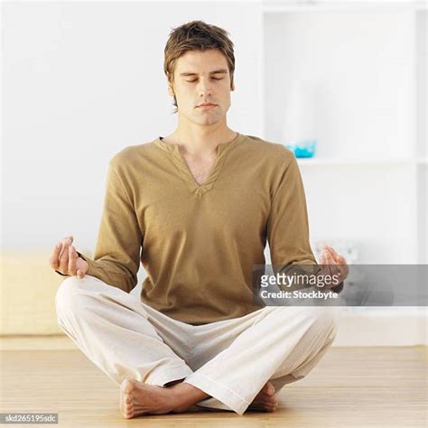 41 Man Sitting Cross Legged On Floor Eyes Closed Portrait Stock Photos