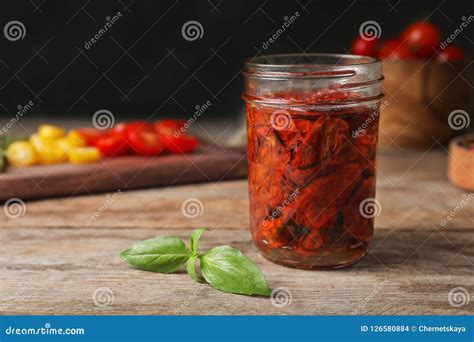 Jar With Sun Dried Tomatoes On Wooden Table Stock Photo Image Of