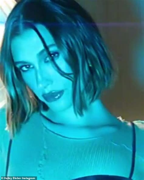 Hailey Bieber Vamps For The Camera In A Nude Shirt Under A Brown Dress