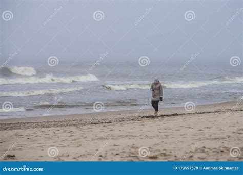 A Woman Walks On A Baltic Sea Beach Editorial Stock Image Image Of