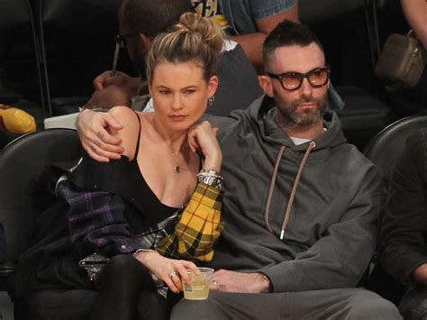 Behati Prinsloo And Adam Levine Kissing