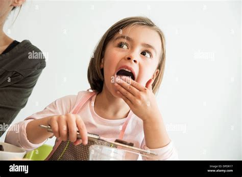 Young Woman Licking Finger Hi Res Stock Photography And Images Alamy