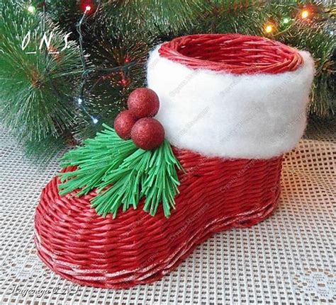 A Red And White Basket With Christmas Decorations On It