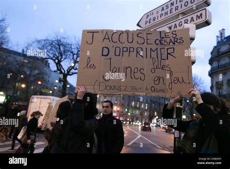 Feminist Activists Holding Signs Demonstrate Outside The Salle Pleyel