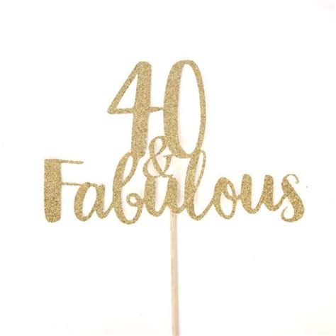 A Cake Topper With The Words 40 And Fabulous Written In Gold Glitter On It