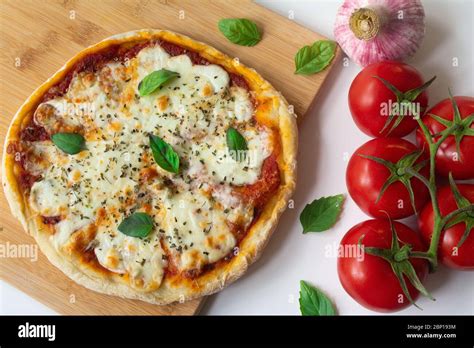 Homemade Italian Pizza Napoletana With Fresh Tomato And Garlic Sauce