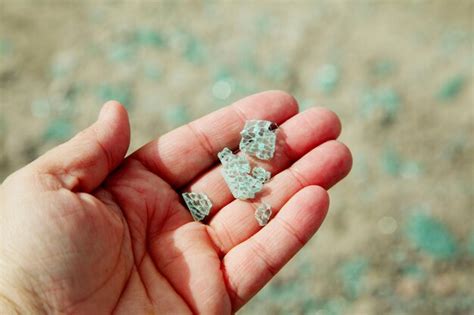 Premium Photo Close Up Of Person Hand Holding Pieces Of Glass