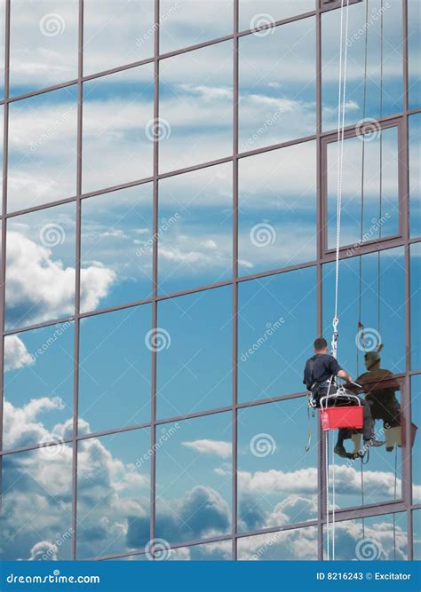 Window Washer Scaffold On Blue Angled Glass Royalty-Free Stock Image