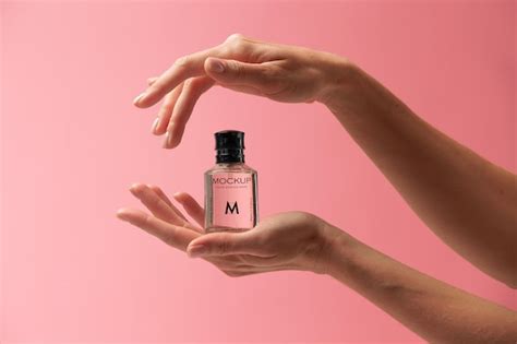 Premium Psd Person Holding Mock Up Glass Bottle Of Perfume