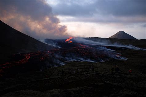 'Orange like the sun': Tourists drawn to Iceland volcano despite warnings