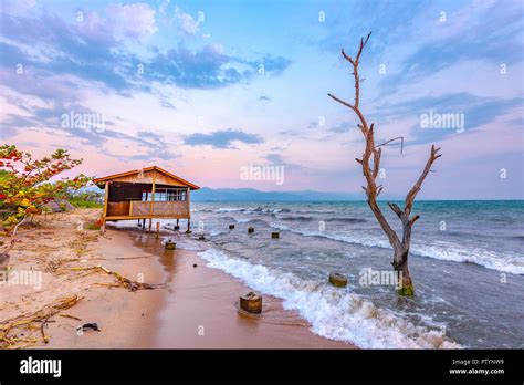 Burundi Bujumbura Lake Tanganyika Windy Cloudy Sky And Sand Beach At