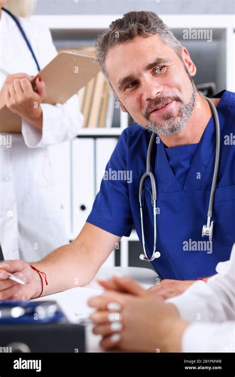 Smiling Handsome Mature Doctor Communicate With Patient Stock Photo Alamy