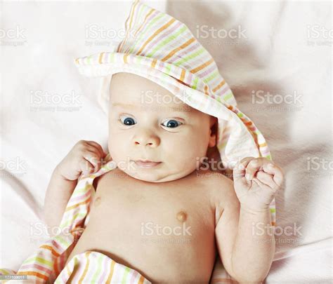 Picture Of The Newborn Resting On A Bed Stock Photo Download Image