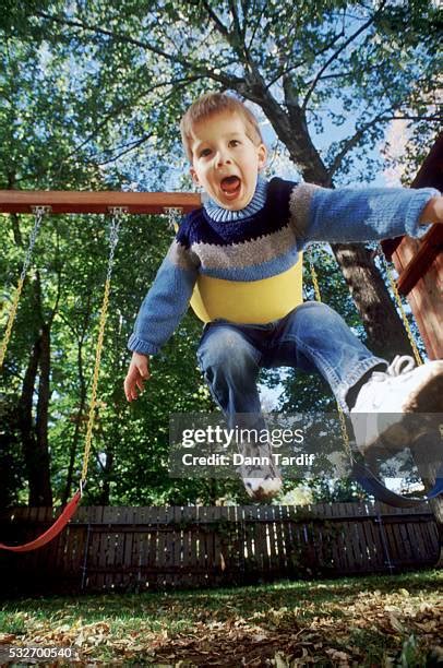 25 Kid Jumping Off Swing Stock Photos, High-Res Pictures, and Images ...