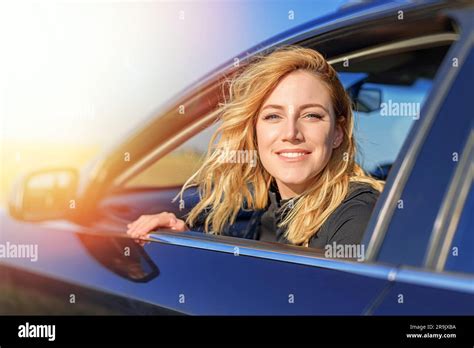 Beautiful Blonde Woman Driving A Car Stock Photo Alamy