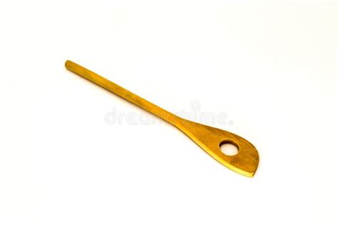 Wooden spoon with a hole stock image. Image of studio - 176389471