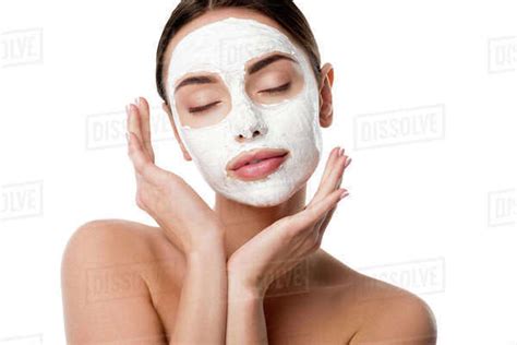 Beautiful Nude Woman With Facial Skin Care Mask And Eyes Closed Isolated On White Royalty Free