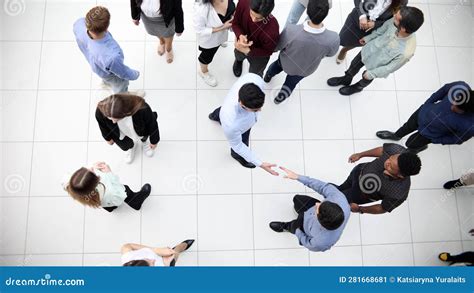 Group Of Different Business People Passing In The Office Lobby Stock