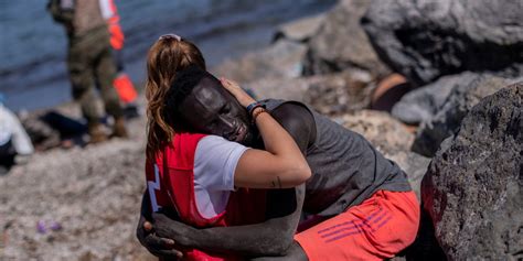 Watch White Red Cross Worker Who Cradled African Migrant Abused Online