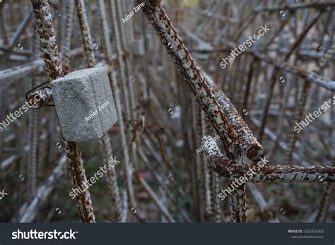 Closeup Concrete Covering Barrier Rebar That Stock Photo 1320320303