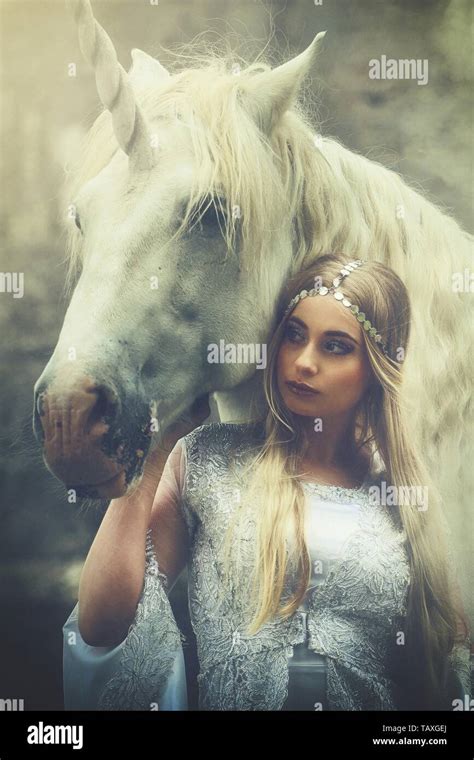 Woman And Unicorn Stock Photo Alamy