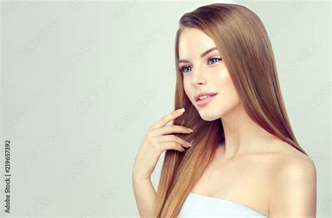 Beautiful Model Girl With Shiny Blonde Straight Long Hair Care And