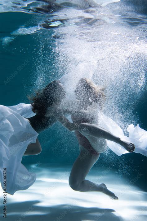 Two Beautiful Lesbian Girls Are Swimming Underwater Attractiveness