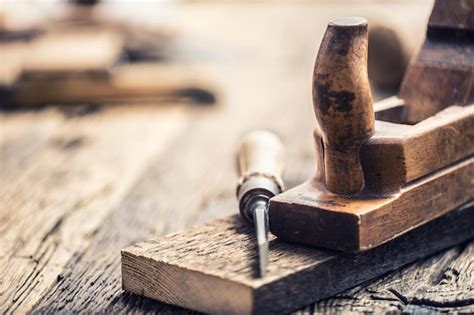 Premium Photo | Old planer and other vintage carpenter tools in a carpentry workshop