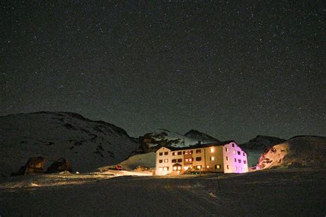 Illuminated House under a Night Sky · Free Stock Photo