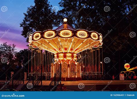 Carousel Merry Go Round In Amusement Park At Evening City Stock Image