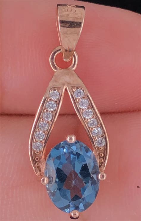 Natural London Blue Topaz Pendant With White CZ In