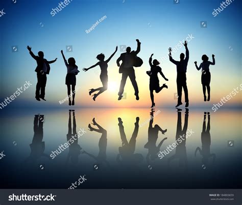 group business people jumping celebrating stock photo