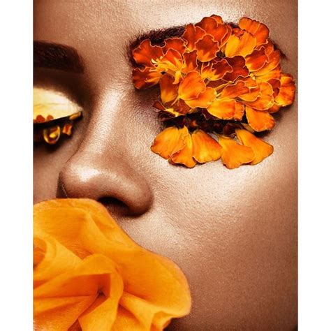 A Woman With Orange Flowers On Her Face