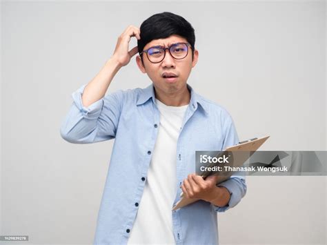 Confused Asian Man With Document Gesture Scratch Head Isolated Stock