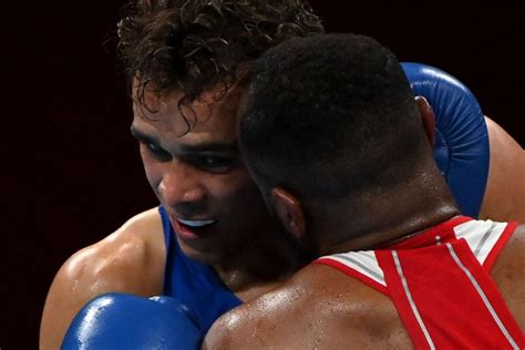 Video: Olympic Boxer Tries To Bite Off Opponent’s Ear Like Mike Tyson